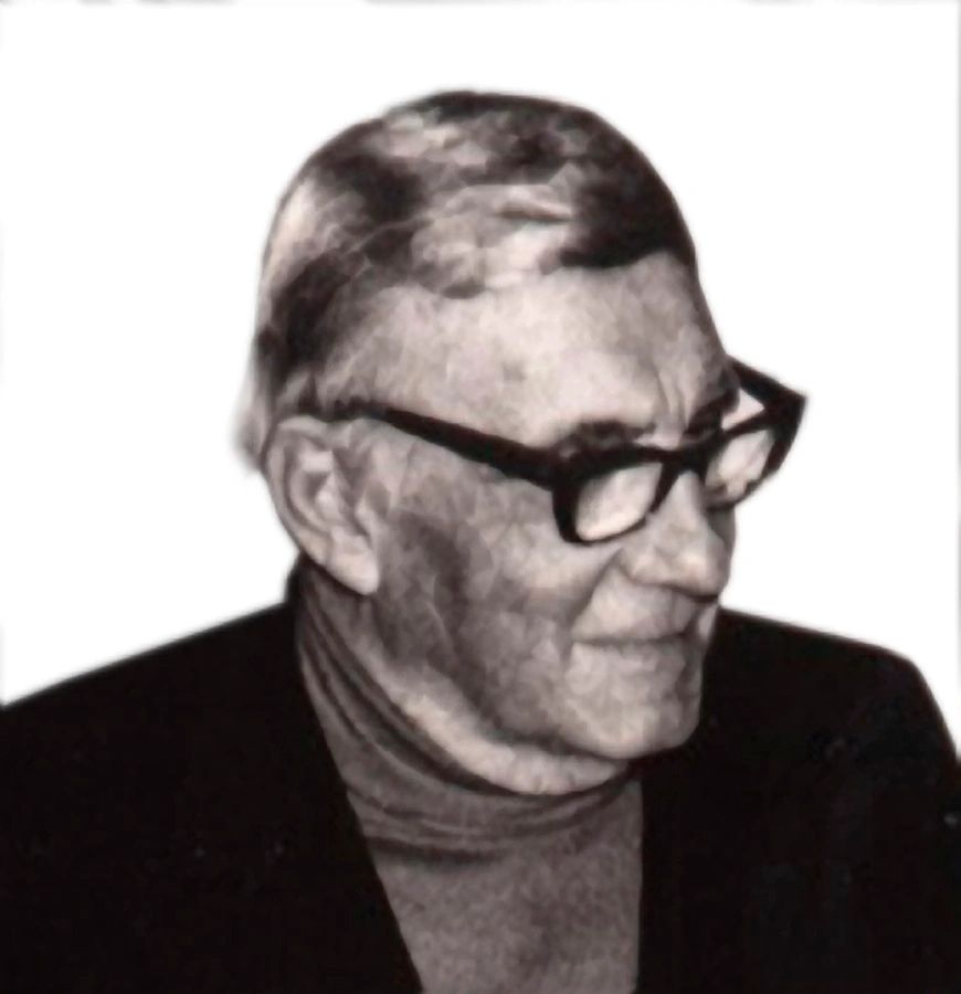 A man with glasses and a jacket on.
